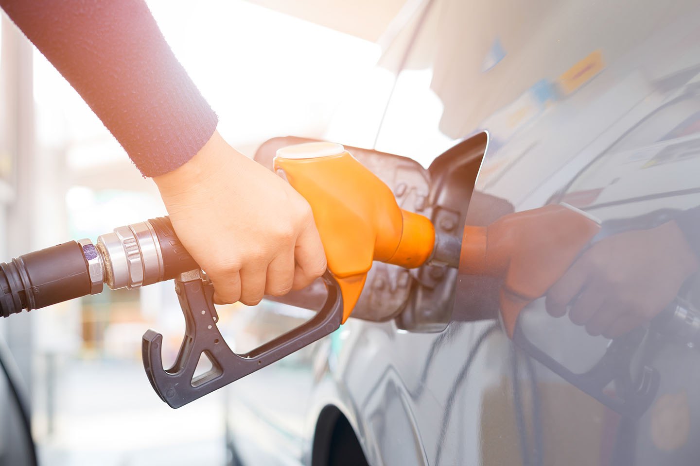 Grey Car Gas Station Being Filled 