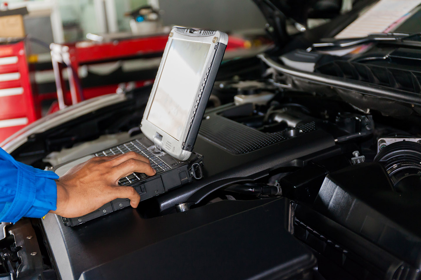 mechanic using a diagnostic machine